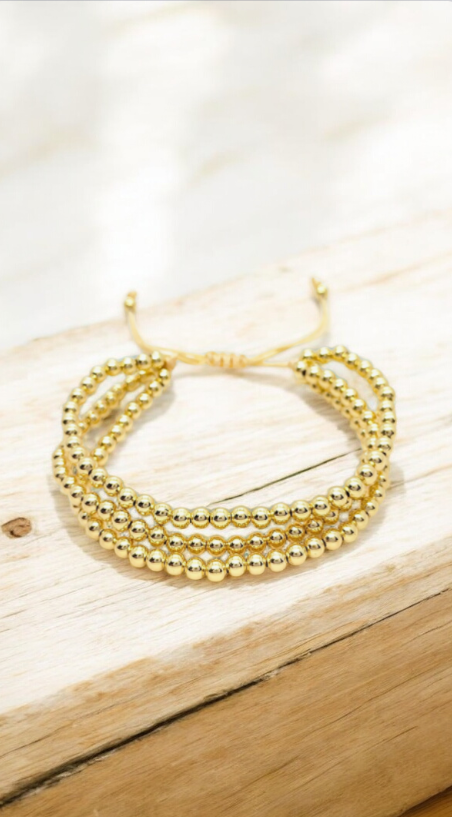 Pulseras dorada de tres vueltas