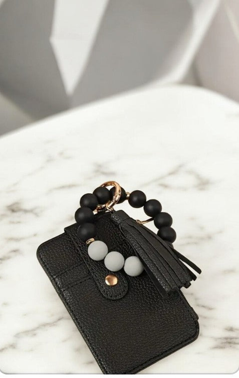 Llavero tarjetero en forma de pulsera en negro