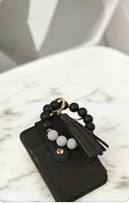 Llavero tarjetero en forma de pulsera en negro
