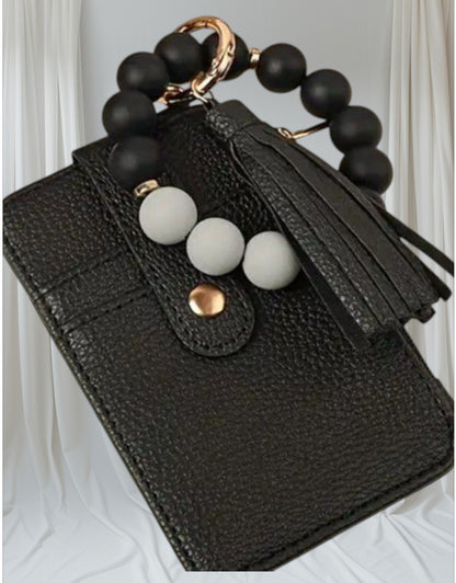 Llavero tarjetero en forma de pulsera en negro